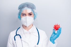 lady doctor hold corona virus microbe figure 1