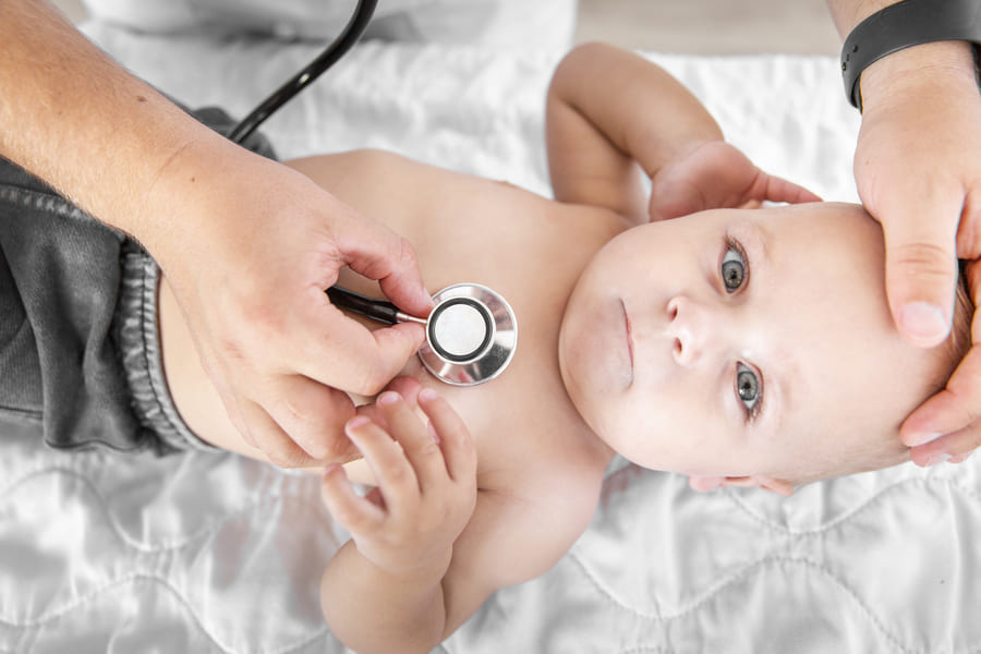 top-view-hands-listening-little-baby-with-stethoscope (1).jpeg